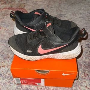 Girls Nike size 13.5 Revolution black and pink sneakers.